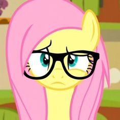 a pink pony with glasses on it's face