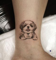 a small dog tattoo on the ankle