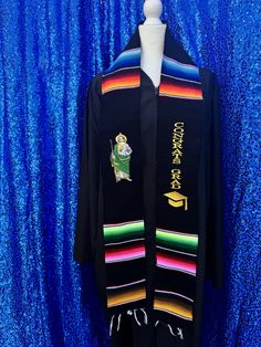 "Beautiful and unique design  Mexican United States stole   2024 Unisex  Limited edition  Adult  Stole graduacion  New design  50% cotton 50% polyester  Hermosa estola para graduación  Bandera de mexico y Estados Unidos Graduation Stole background with multicolored stripes.  These are authentic Mexican serapes woven from acrylic fibers.  embroidery stole Beautiful and unique design design  Approximate Length: 85\" Length by 5\" Wide" Embroidered Black Graduation Stole, Traditional Embroidered Graduation Stole, Multicolor Embroidered Graduation Stole, Embroidered Multicolor Graduation Stole, Graduation Mexican, Graduation Sash, Mexican Serapes, Graduation Stole, Authentic Mexican