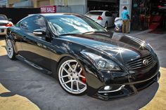 a black car parked in front of a building