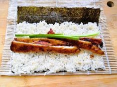 a plate with rice, meat and vegetables on it