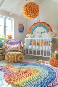 a crocheted rainbow rug in a child's room next to a white crib