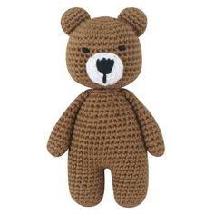 a crocheted teddy bear with a black heart on it's chest and eyes