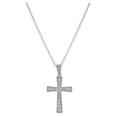 This cross pendant boasts a timeless design, expertly crafted from 18KT white gold and adorned with sparkling round brilliant cut diamonds. The total carat weight of the diamonds is 0.29CT-TW, with a G color grade and VS2-VS2 clarity. The combination of the elegant white gold setting and the high-quality diamonds creates a piece that radiates both grace and sophistication. Length 18 inches. Weight 2.9 grams. Hamsa Pendant, White Gold Set, Diamond Cross Pendants, Diamond Cross, Modern Necklaces, Quality Diamonds, Pendant Set, Diamond Stone, Brilliant Cut Diamond