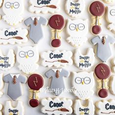 decorated cookies are arranged in the shape of shirts and ties