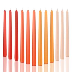 six candles are lined up in different colors