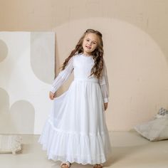 When it comes to selecting the perfect first communion dress, many parents and young girls are looking for something that combines elegance, tradition, and modesty. A holy communion gown with sleeves and a veil can be the ideal choice for this special occasion. The addition of sleeves to a communion dress not only adds a touch of sophistication but also ensures that the young girl feels comfortable throughout the ceremony. Lace communion dresses with sleeves are particularly popular as they exud Fitted First Communion Dress, White Fitted First Communion Dress, White Lace Trim First Communion Dress For Confirmation, Lace First Communion Dress With Lace Sleeves For Confirmation, Fitted Lace First Communion Dress, Fitted First Communion Dress With Lace Sleeves, White Lace Trim Dress For First Communion And Pageants, White Lace Trim First Communion Dress For Pageant, First Communion White Lace Dress With Long Sleeves