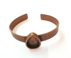 Material Wrist strap : Brass Blank : zinc alloy Nickel Free and Lead Free Color: Antique Copper Wristband Width : 10mm Blank Size : 18x13 mm Drop blank inner depth : 3 mm Quantity : 1 pc. To see other all Silver Bracelet Blanks please click below https://www.etsy.com/shop/AZsupplies/search?search_query=bracelet+blank+silver&order=date_desc&view_type=list&ref=shop_search To see other all Silver Ring Blanks please click below https://www.etsy.com/shop/AZsupplies/search?search_query=nic Adjustable Stamped Metal Cuff Bracelet, Adjustable Metal Cuff Bracelet With Stamped Detail, Adjustable Oval Metal Bracelets, Adjustable Copper Teardrop Jewelry, Adjustable Bronze Cuff Jewelry, Adjustable Teardrop Copper Jewelry, Bronze Copper Cuff Jewelry, Bracelet Blanks, Ring Blanks