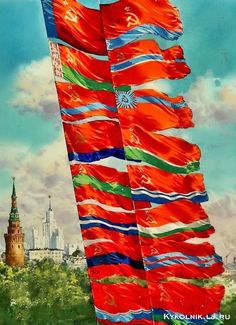 two large flags are flying in the wind with a cityscape in the background