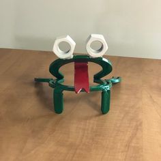 two white and green objects sitting on top of a wooden table