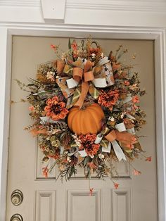 a wreath is hanging on the front door