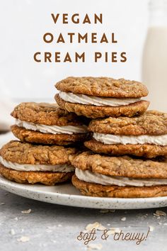 vegan oatmeal cream pies on a plate with milk in the background