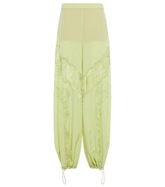 These pants from Stella McCartney have wide legs gathered at the ankle with elasticated cuffs for a luxuriously comfortable fit. They are crafted from featherlight green silk and decorated with delicate lace inserts. | Stella McCartney Silk and lace pants Stella Mc, Silk And Lace, Lace Pants, Lace Insert, Wide Legs, Green Silk, Stella Mccartney, Wide Leg Pants, Harem Pants