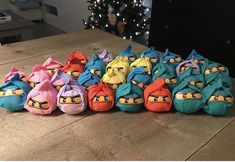 several bags with angry birds on them sitting on a table next to a christmas tree