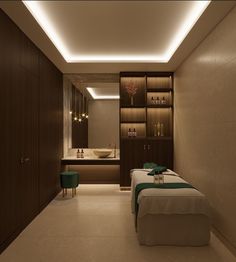 a spa room with two massage beds and lights on the wall above them, in front of a large mirror