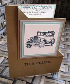 a close up of a card with an old fashioned car on the front and back