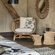 a wicker chair and mirror in a room