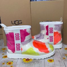 Shop marisales805's closet or find the perfect look from millions of stylists. Fast shipping and buyer protection. UGG CLASSIC CLEAR MINI SIZE-6 WHITE/PURPLE/LIGHT PURPLE/ BRIGHT ORANGE NO BOX AUTHENTIC ‼️ Ugg Classic Clear, Orange Slippers, Ugg Leather Boots, Ugg Sandals, Ugg Dakota, Leopard Loafers, Weatherproof Boots, Chestnut Leather, Ugg Classic Mini