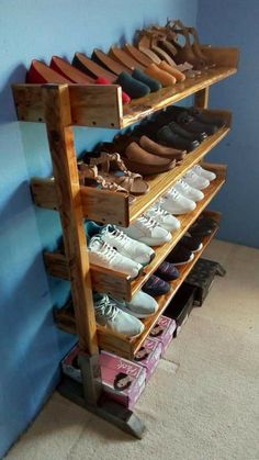 a wooden shoe rack filled with lots of shoes