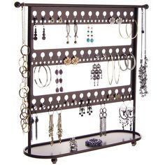 a jewelry rack with lots of earrings on it