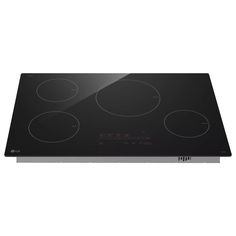 a black stove top with four burners