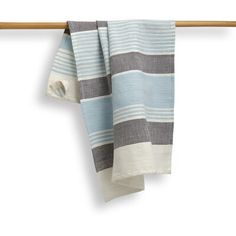 a blue and white striped towel hanging on a clothes line with a wooden hanger