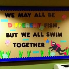 a bulletin board that says we may all be different fish but we all swim together