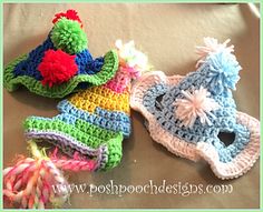 three crocheted hats with pom poms on them