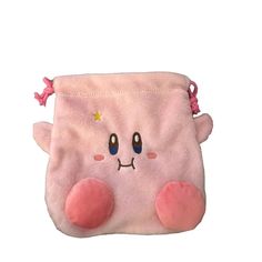 a small pink bag with eyes and ears