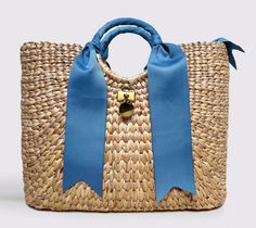 MME.Mink Bentley Tote in Cornflower Our HIGHLY Coveted BENTLEY Tote is the Grand Dame of our woven Collection. This tote is the largest of our basket totes. Made from organic grass fibers woven and strung as per MME.MINK design, this beautiful handbag is made in limited quantities for the Season. Our signature hardware and ribbon details make the tote distinctive and special. Each bag is hand-numbered with our authenticity label and treated with our white-glove handling to make each piece a very Luxury Woven Jute Straw Bag, Luxury Jute Straw Bag For The Beach, Luxury Woven Straw Bag In Natural Color, Luxury Open Weave Straw Bag For Summer, Luxury Summer Straw Bag With Open Weave, Luxury Handwoven Straw Basket Bag, Luxury Handwoven Basket Straw Bag, Rectangular Straw Bag With Intrecciato Weave, Basket-shaped Straw Bag With Intrecciato Weave