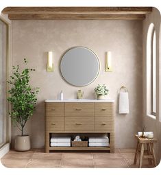 a bathroom with a sink, mirror and potted plant