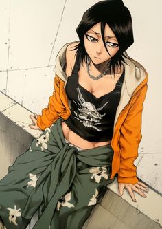 a woman sitting on the ground with her hands in her pockets and wearing an orange jacket