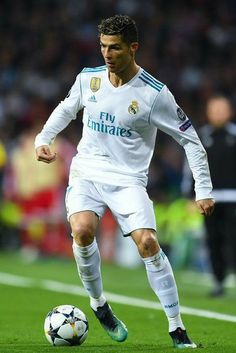 the soccer player is about to kick the ball in his team's match with real madrid