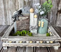 an old wooden crate with flowers, eggs and a sign that says together is our favorite place to be