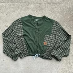 a green shirt with a plaid pattern on it