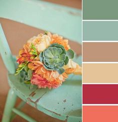 a bouquet of flowers sitting on top of a chair next to a color swatch