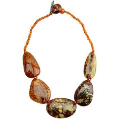 Piece by polish designer, Amber is the fossilized resin from ancient forestsIf you love amber you will love this original piece. Close matching color earrings AMER121516-01 Stones: Baltic Amber Length: Necklace is approx. 18" in length Width: Center stone approx. 2" long x 1 1/4" wide and is approx. 1/4" thick (depth) Material: Cotton Thread Made in: Poland Stone Statement Necklace, Color Earrings, Ancient Forest, Length Necklace, Amber Stone, Baltic Amber, Cotton Thread, Cognac, Color Matching