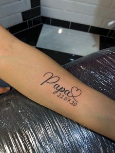 a person with a tattoo on their arm that says papos 2013 and has hearts