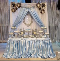 a blue and white wedding dessert table