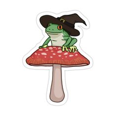 a frog sitting on top of a mushroom wearing a witches hat