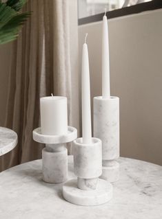 set of three white marble candle holders on a white marble table Stone Candle Holder, Marble Accessories, Marble Candle Holder, Stone Candles, Marble Home, Stone Accessories, Marble Decor, Porous Materials, Candle Holder Set