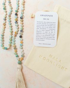 This Mala Beads Necklace is hand-knotted with Amazonite crystals and features 14K Gold-filled accent beads and a handmade cotton tassel. Hand-knotted traditional style This piece has the traditional 108 beads Bohemian 108 Beads Mala For Blessing, Bohemian Necklaces With 8mm Beads For Rituals, Bohemian Mala With 108 Beads For Blessing, Bohemian Mala With 8mm Beads For Blessing, Holistic Hand Knotted Jewelry For Rituals, Adjustable Bohemian Mala For Blessings, Spiritual Tassel Necklace With 108 Round Beads, Adjustable Spiritual Tassel Necklace With Natural Stones, Adjustable Tassel Necklace With Natural Stones For Gift