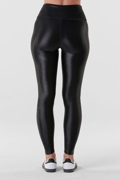 Liquid style from studio to street - meet the Liquid Legging - Black Gloss. Lightweight, lustrous shine, quick drying, and a second skin feel. Smoothing, butt-lifting and so versatile, this legging shines from workout to wear out. Made from imported Brazilian fabric: Xtra Life Lycra for resilience and longevity, this style features four-way stretch. If you fall in between sizes, we recommend sizing down. Black Liquid Leggings, Heart Pump, Athletic Build, Liquid Leggings, Black Liquid, Black Gloss, Second Skin, New Shop, Black Leggings