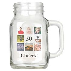 a glass mason jar filled with photos and the words cheers