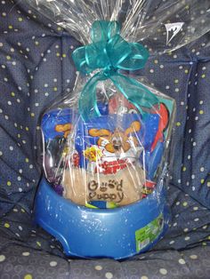 a blue plastic basket filled with toys on top of a chair