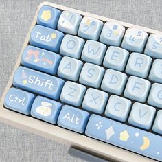 a computer keyboard with blue keys and white letters on the keycaps is shown