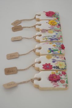 a row of tags with flowers on them