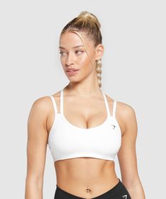 IT’S NOT YOU, IT’S YOUR SPORTS BRA With lightweight, breathable designs, comfortable cups and supportive straps, you can rely on our sports bras to be there for you, and for yours. • Cute double strap feature• Removable padding lets you to wear it how you want• Light V-neck• Stay-put elasticated underband SIZE & FIT• Medium support• Body fit• Model is 5’8” and wears a size XS MATERIALS & CARE• 78% Recycled Polyester, 22% Elastane SKU: B8A6A-WB57 Trendy Workout Outfits, Gym Bra, Best Sports Bras, British Women, White Sports Bra, Popular Sports, Comfy Fashion, Sport Bra, Seamless Leggings