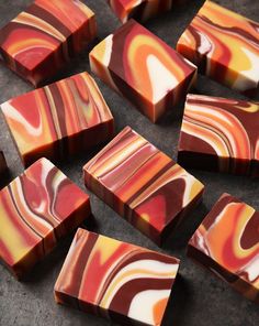 several pieces of red and yellow swirled chocolate