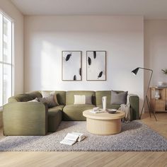 a living room filled with furniture next to a large window and a wooden table in front of it